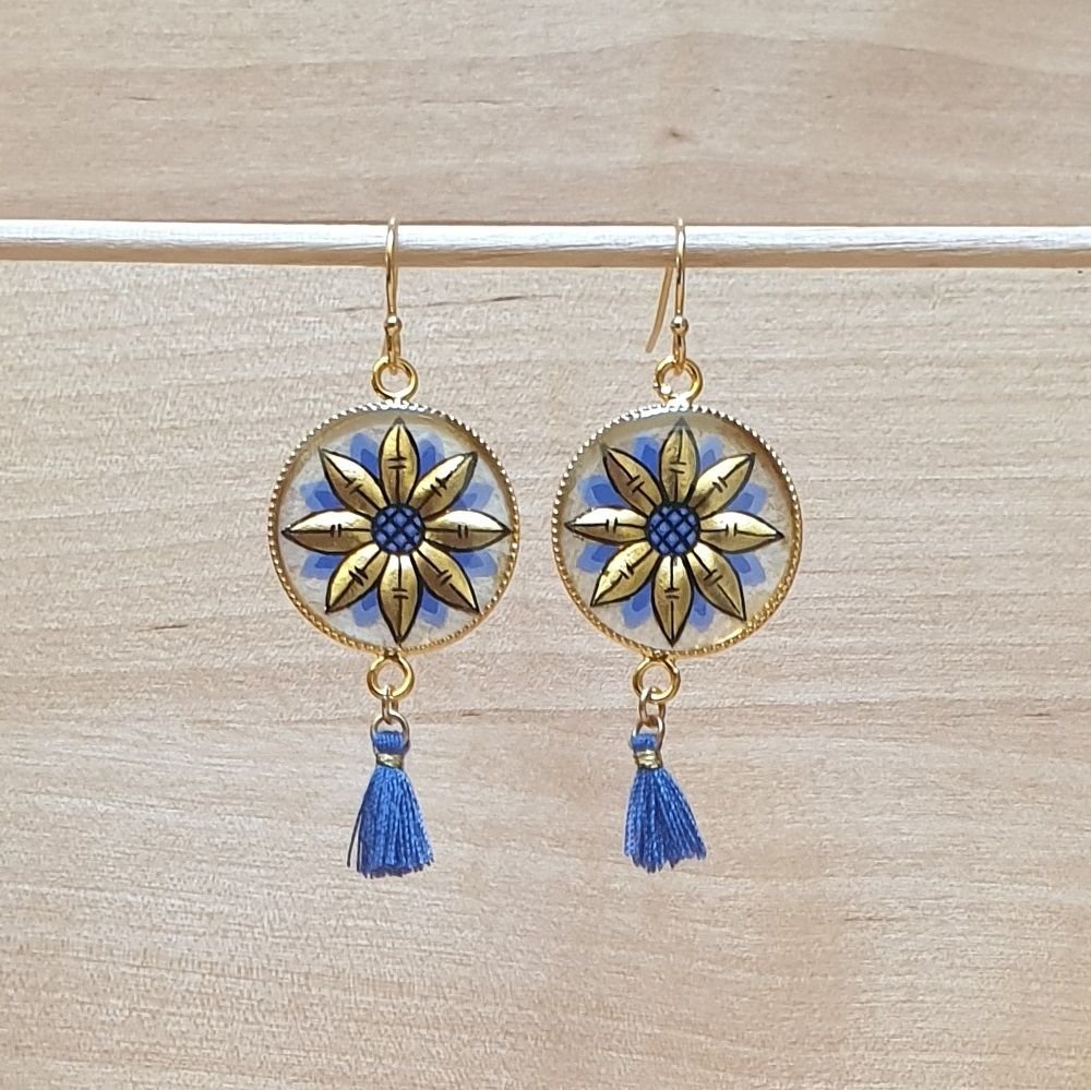 Gouden/blauwe bloem oorbellen