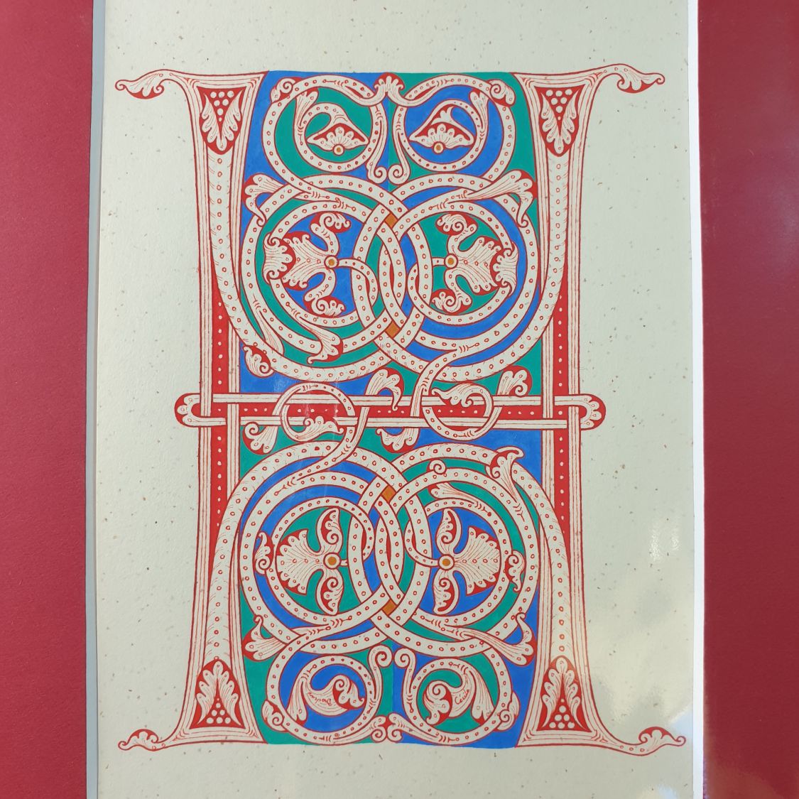 Verlichte letter H in Romaanse stijl