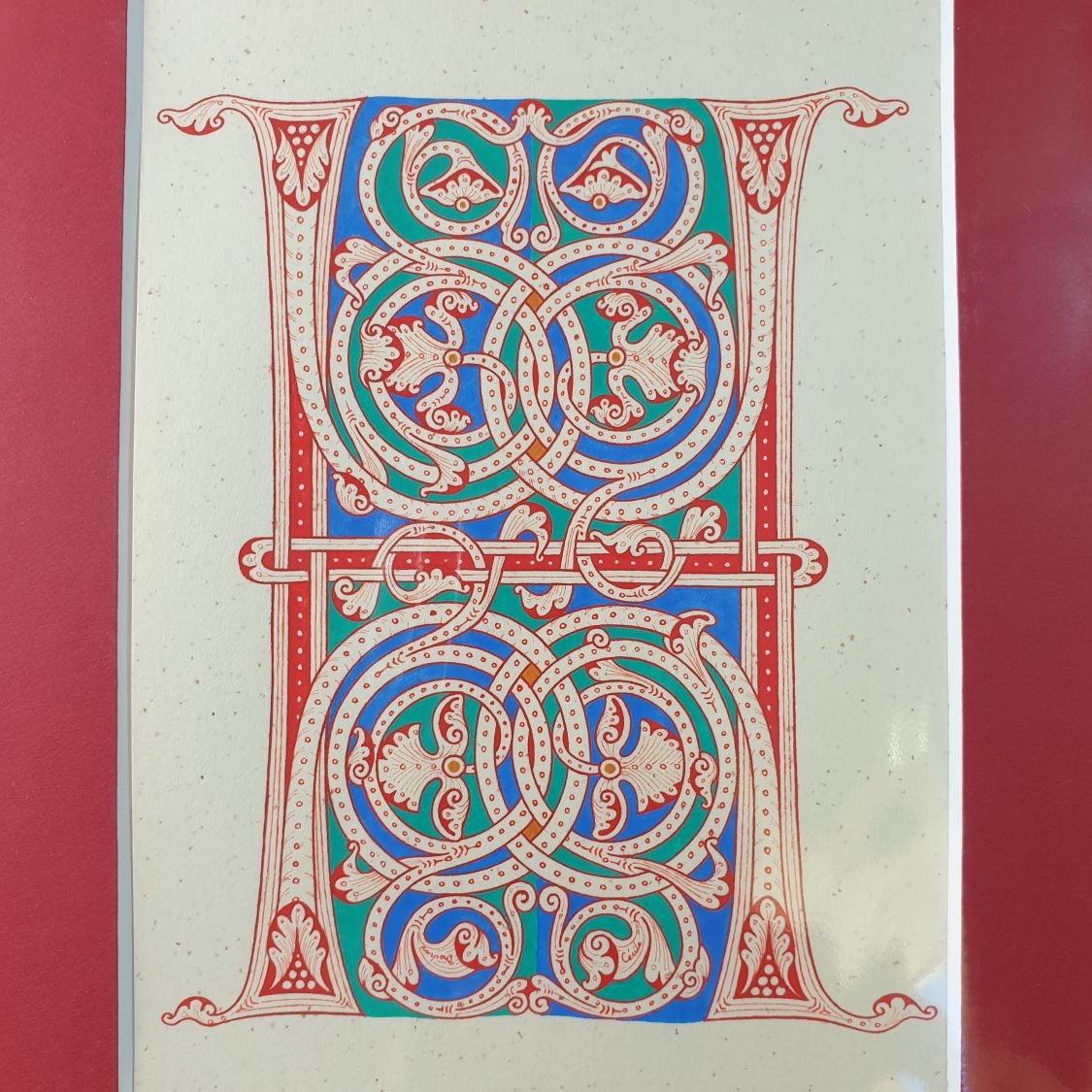 Verlichte letter H in Romaanse stijl
