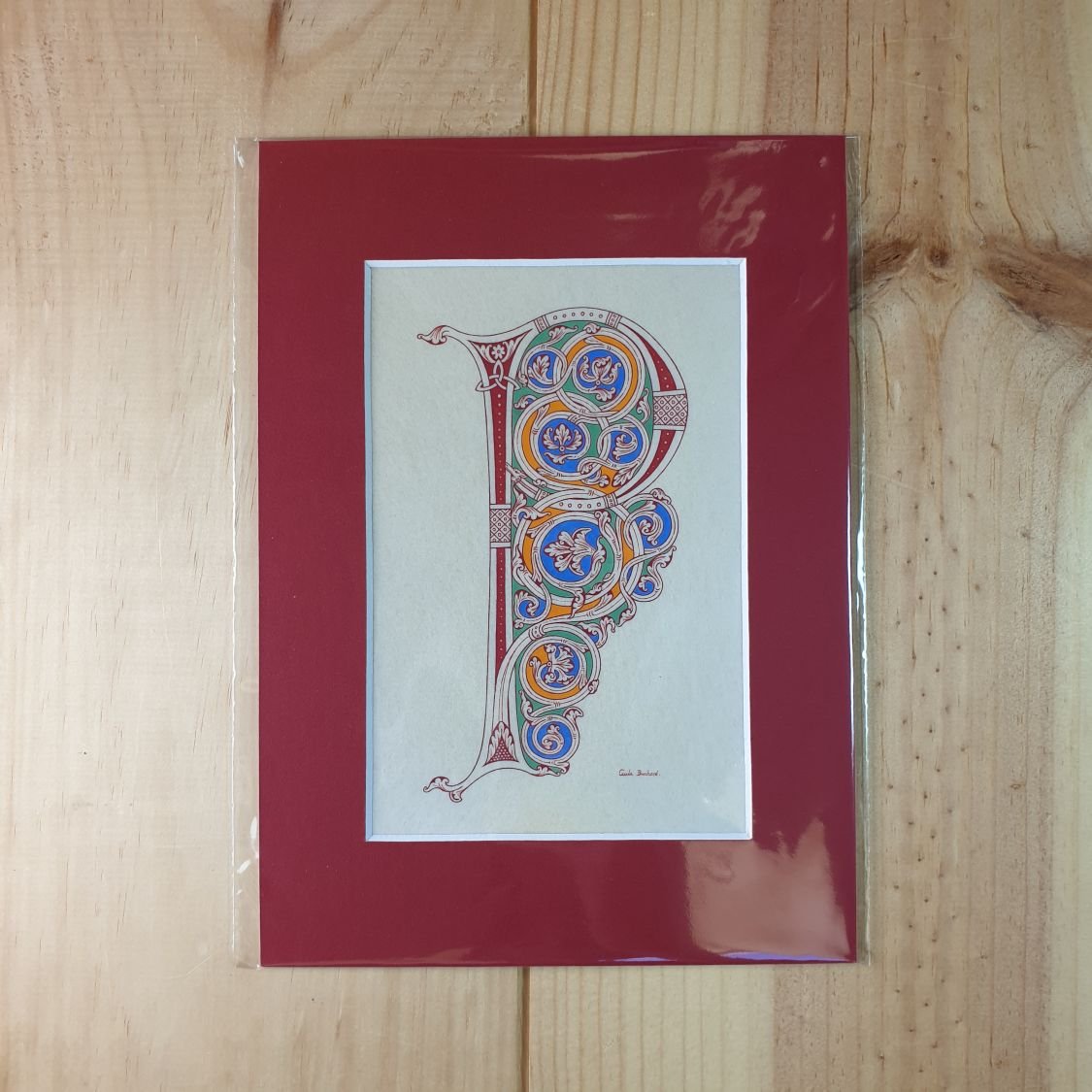 Verlichte letter P in Romaanse stijl