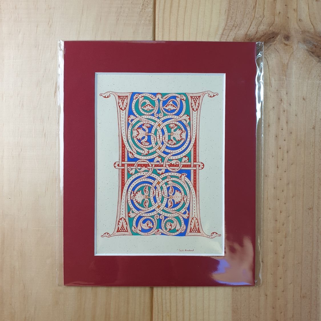 Verlichte letter H in Romaanse stijl