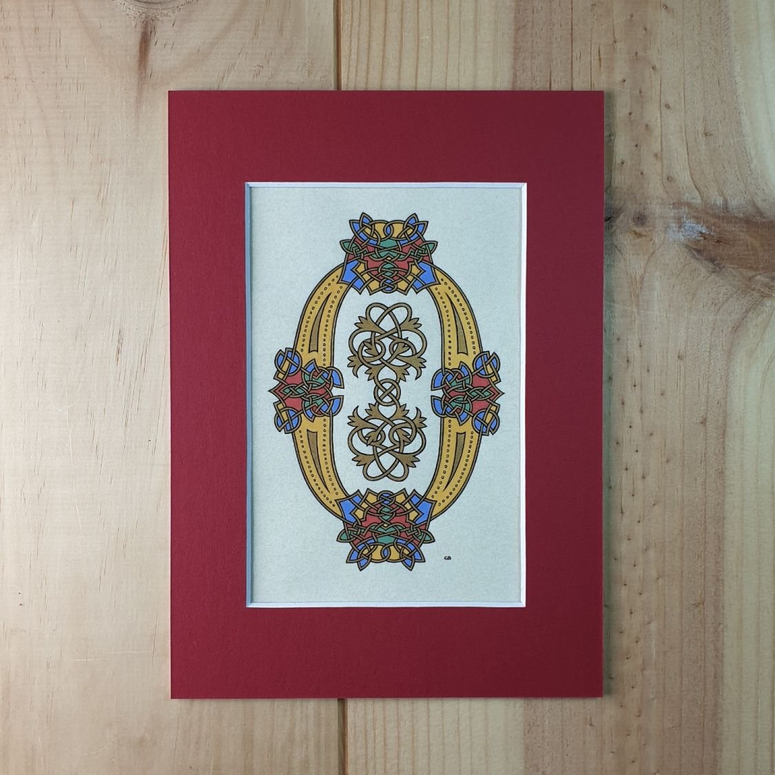 Verlichte letter O in Romaanse stijl