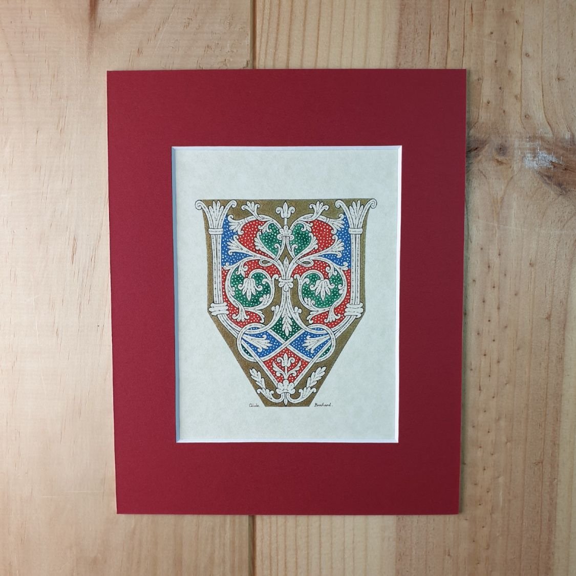 Verlichte letter V in Romaanse stijl