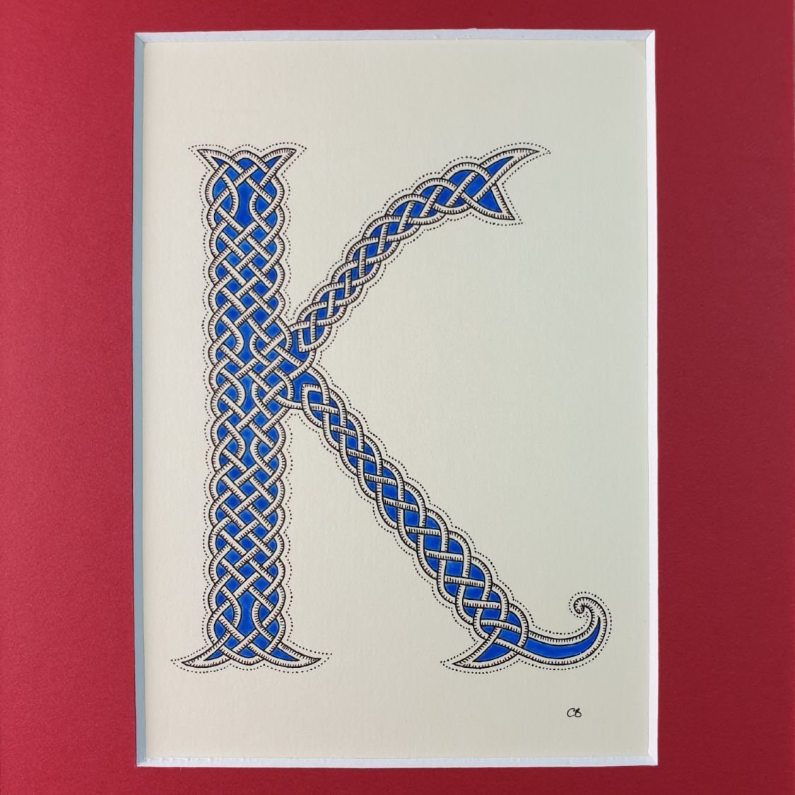 Verlichte letter K met interlacing