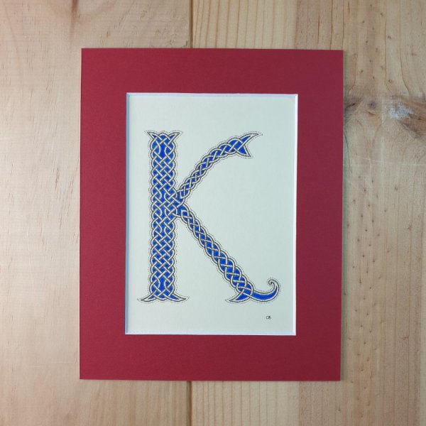 Verlichte letter K met interlacing